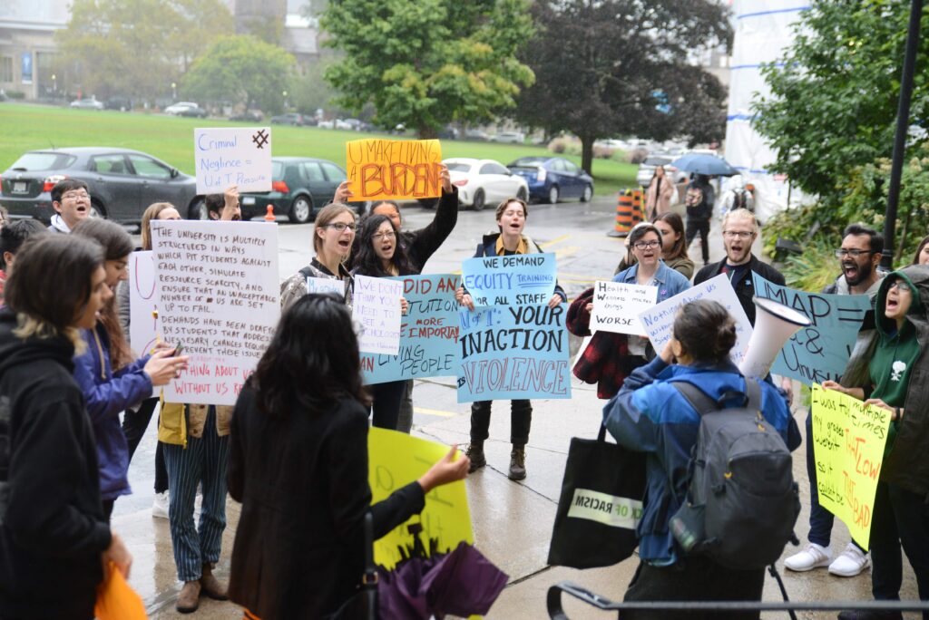 Students rally outside of Simcoe Hall, where the academic board of the University of Toronto's Governing Council held a meeting on Oct. 3, 2019.